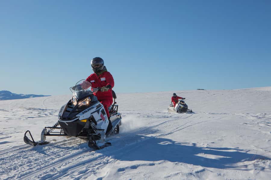Queenstown: Snowmobiling Experience with Helicopter Flight - Riding through the Garvie Mountain Range