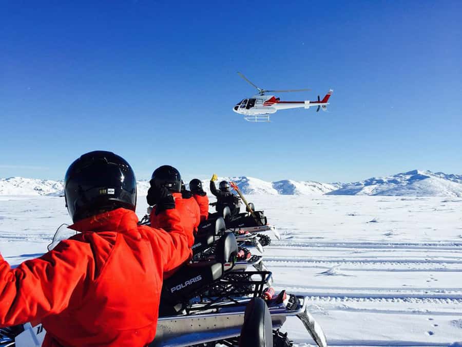 Queenstown: Snowmobiling Experience with Helicopter Flight - From Queenstown hotel pickup to the mountain air