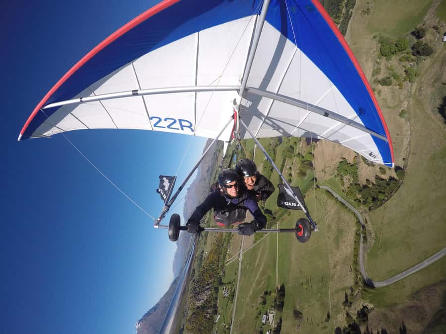 Queenstown: Tandem Hang Gliding Experience - Mountain, forest, and lake views from above