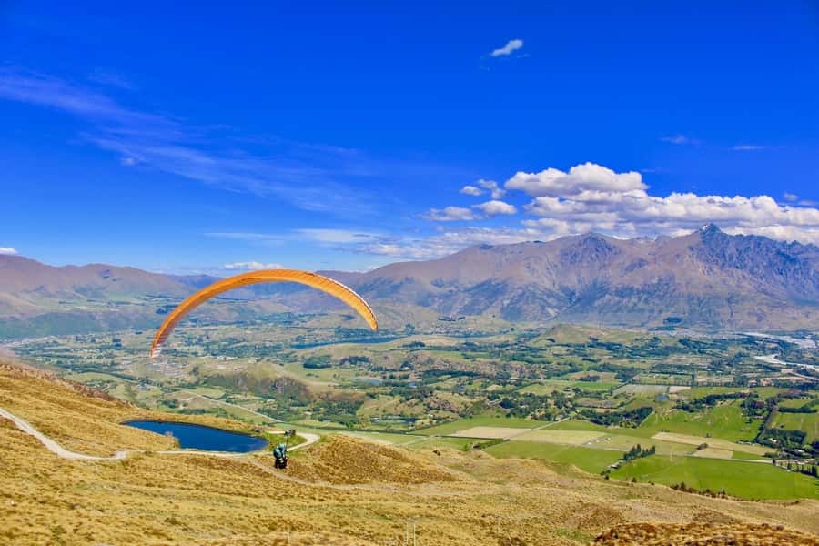 Queenstown: Tandem Paragliding Experience - Taking off from Coronet Peak above Queenstown